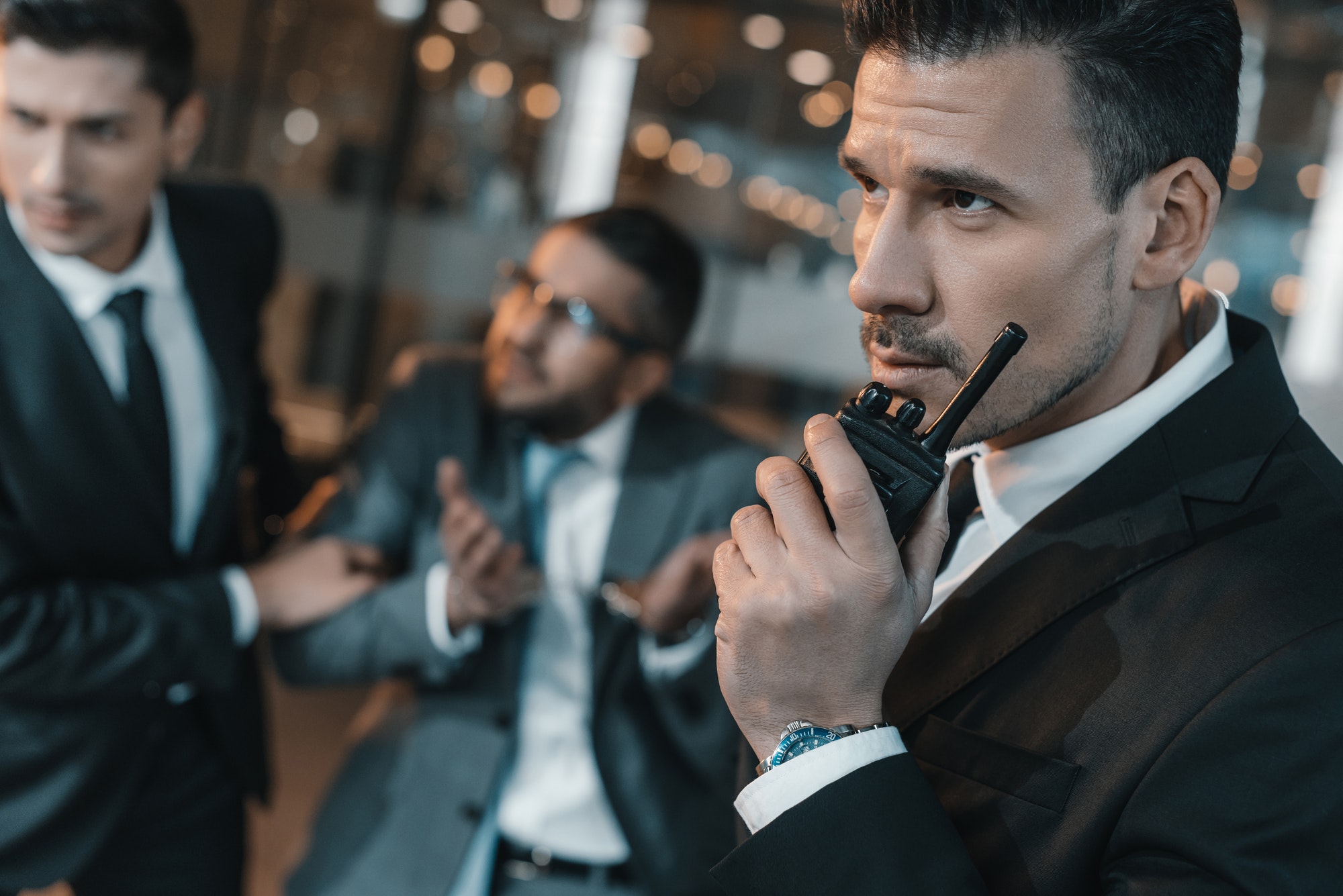 Security guard talking by portable radio
